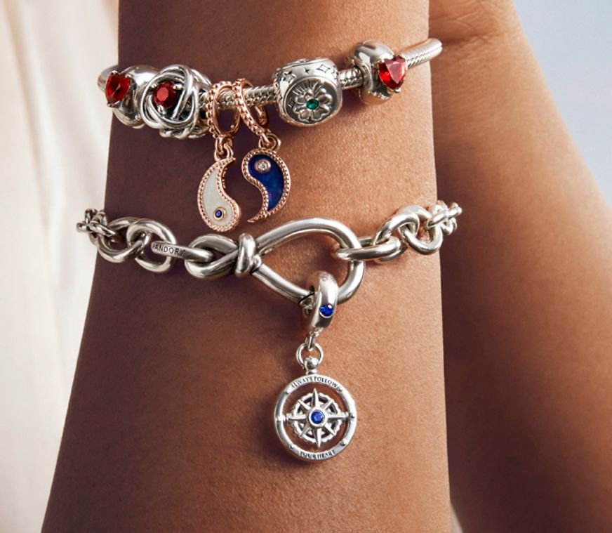 Woman wearing bracelets with colourful charms