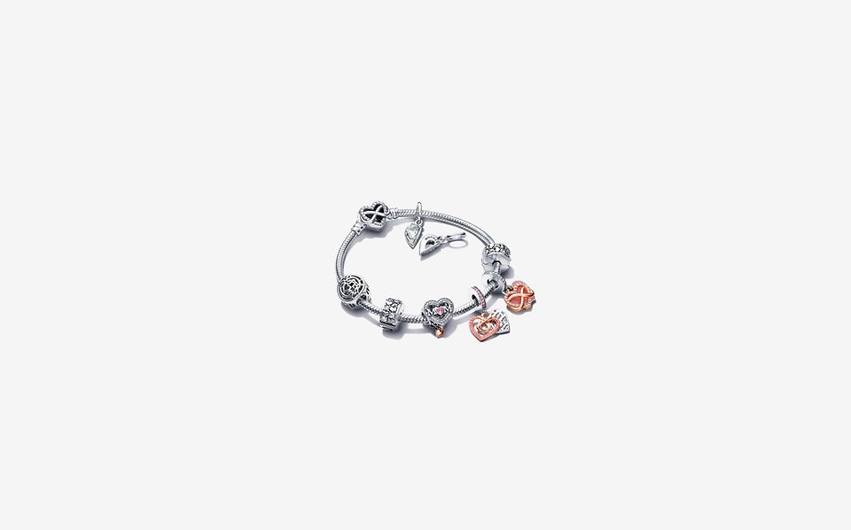Pandora Moments Mother's Day charm bracelet with silver and rose gold charms.