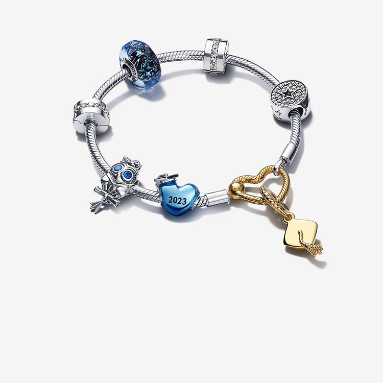 Silver pandora charm bracelet with 7 silver, blue and gold graduation charms