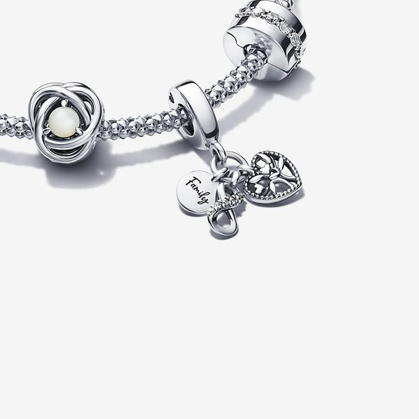 A silver bracelet and nine charms from the Just Because occasion collection