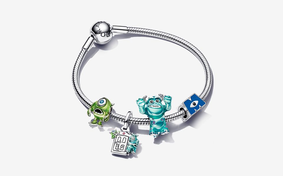 Image of silver charm bracelet with 4 Monsters, Inc. charms