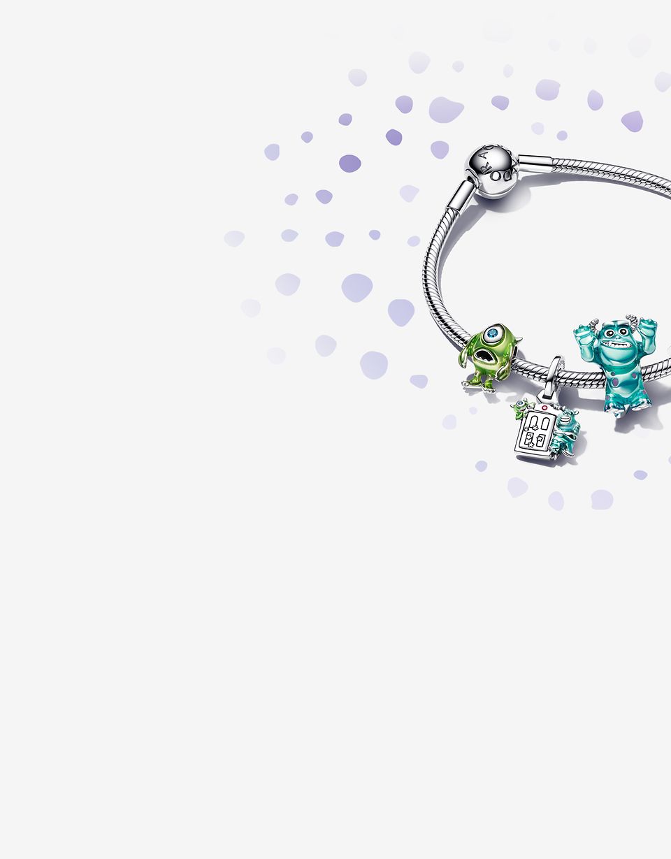 Image of silver charm bracelet with 4 Monsters, Inc. charms