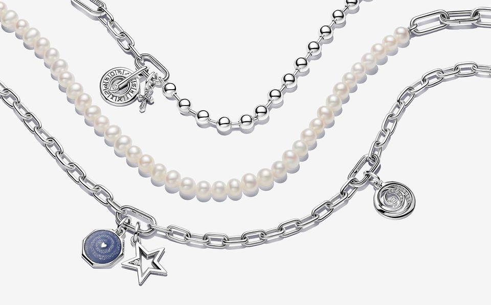 Image of 3 Pandora ME bracelets, 2 silver with charms and 1 pearl and silver.